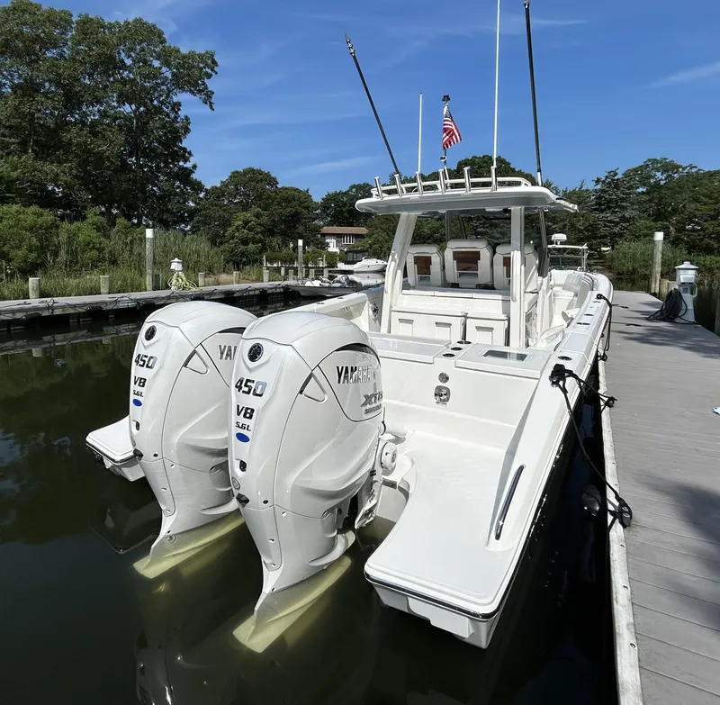 Slide: The Image of 2026 Pursuit S 358 boat docked, featuring twin Yamaha 450 engines. - 3