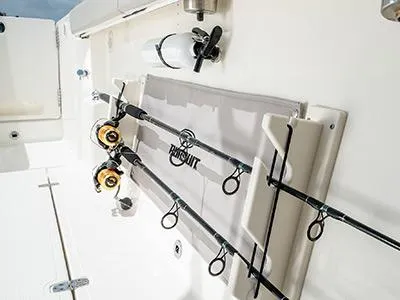 Slide: The Image of Fishing rods secured on a 2026 Pursuit S 358 boat, showcasing storage features. - 9