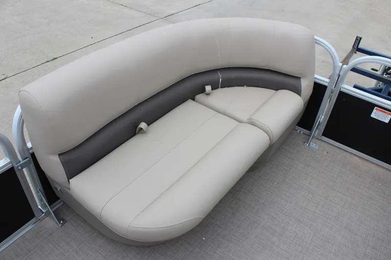 Slide: The Image of 2025 Sun Tracker Party Barge 16 DLX pontoon boat seating, beige upholstery, outdoor setting. - 18