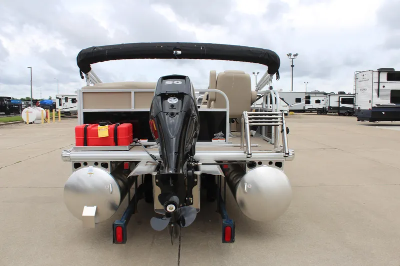 Slide: The Image of 2025 Sun Tracker Party Barge 16 DLX pontoon boat, rear view with motor and fuel tanks. - 2