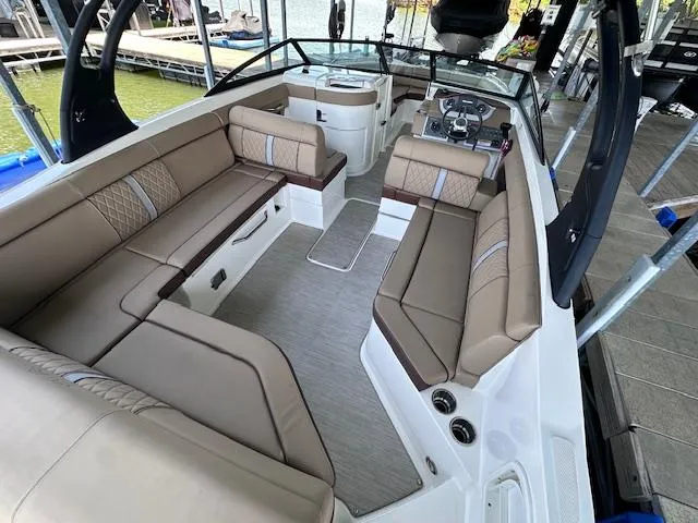 Slide: The Image of 2016 Sea Ray 270 Sundeck interior with spacious seating and modern design. - 13