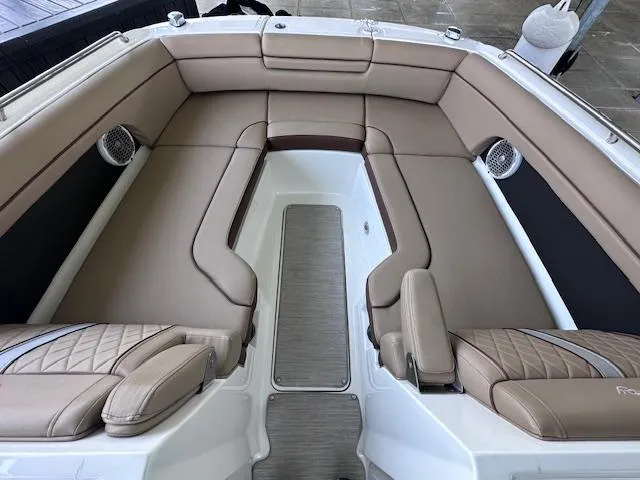 Slide: The Image of 2016 Sea Ray 270 Sundeck interior with tan leather seating and modern design. - 17