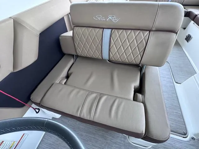 Slide: The Image of 2016 Sea Ray 270 Sundeck boat seat with beige upholstery and diamond stitching. - 19