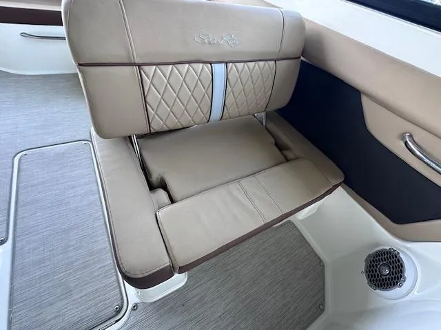 Slide: The Image of 2016 Sea Ray 270 Sundeck interior with beige leather seating and speaker. - 20