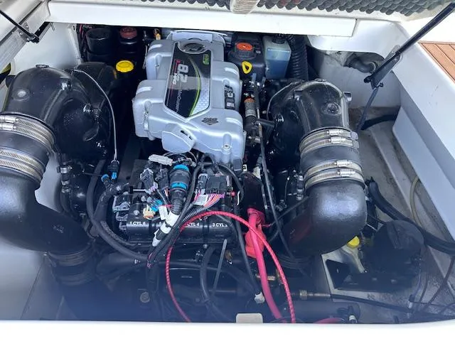 Slide: The Image of Engine compartment of a 2016 Sea Ray 270 Sundeck boat, showcasing detailed components. - 27