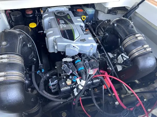 Slide: The Image of Engine of 2016 Sea Ray 270 Sundeck boat, showcasing detailed components and wiring. - 29