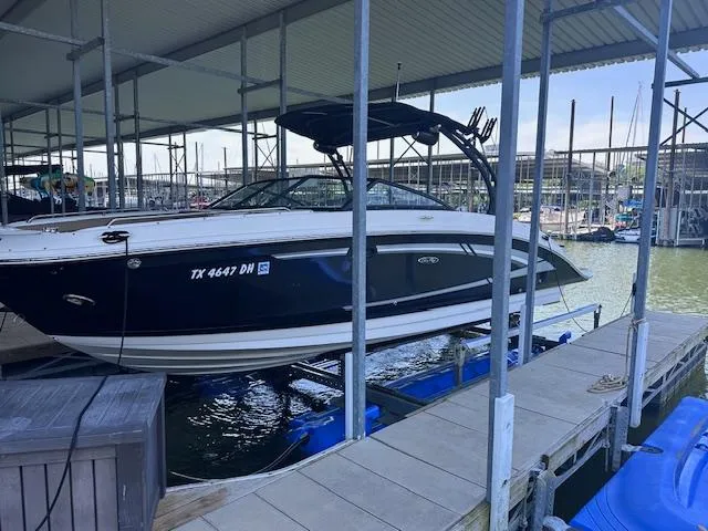 Slide: The Image of 2016 Sea Ray 270 Sundeck boat docked in marina, side view. - 3