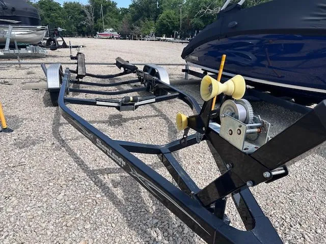 Slide: The Image of Trailer for 2016 Sea Ray 270 Sundeck on gravel lot, surrounded by boats. - 37