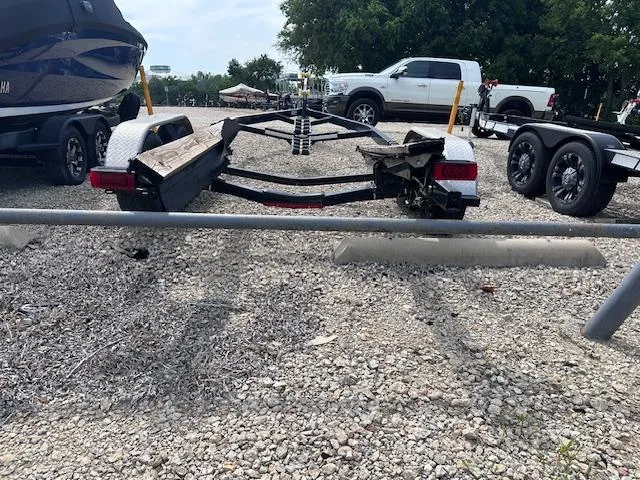 Slide: The Image of Trailer for 2016 Sea Ray 270 Sundeck on gravel lot with vehicles. - 39