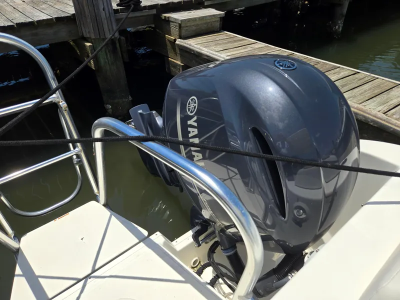 Slide: The Image of Yamaha outboard motor on 2021 World Cat 255C boat docked by wooden pier. - 17