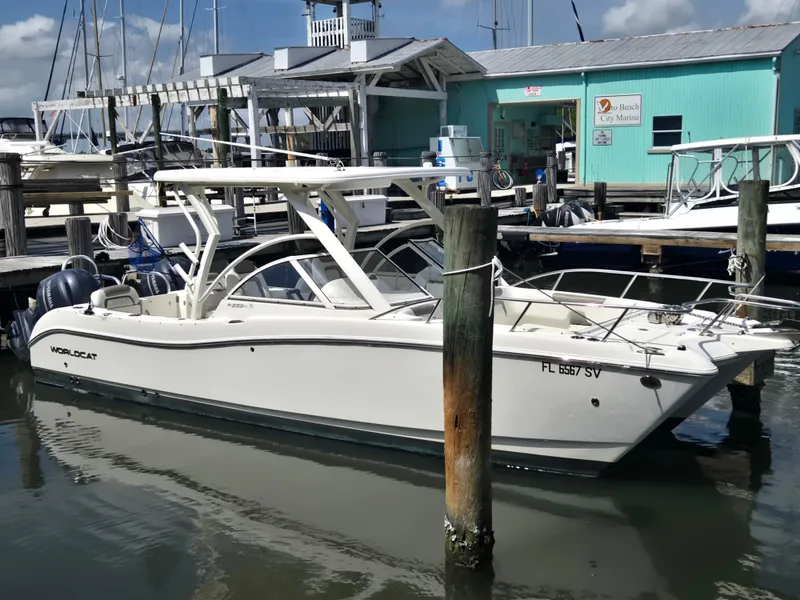 Slide: The Image of 2021 World Cat 255C boat docked at a marina with clear skies. - 22