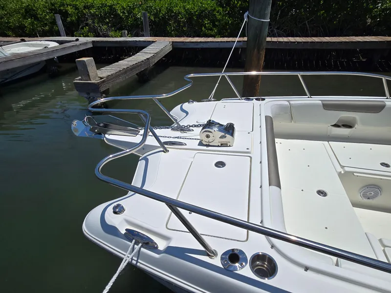 Slide: The Image of 2021 World Cat 255C boat docked, featuring a spacious deck and stainless steel fittings. - 3