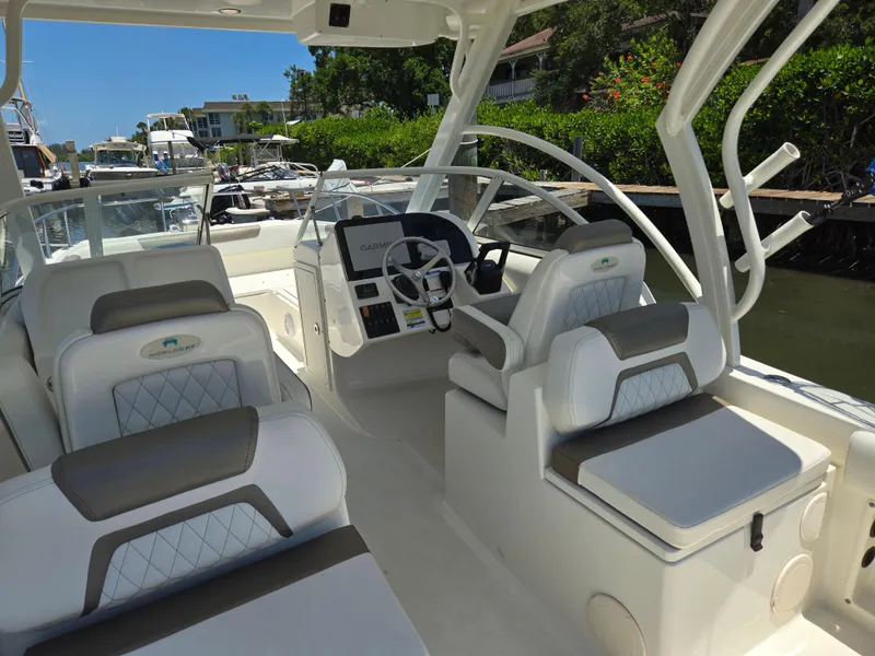 Slide: The Image of 2021 World Cat 255C boat interior with modern seating and steering console. - 4