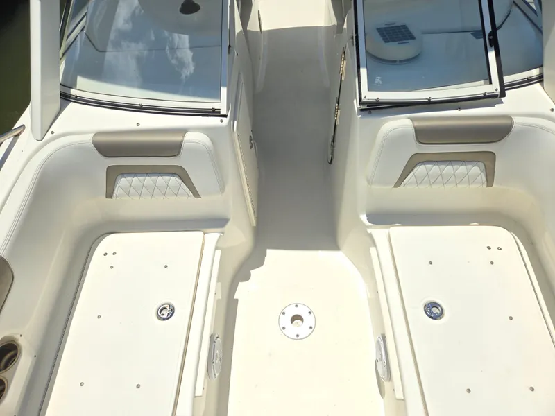 Slide: The Image of 2021 World Cat 255C boat interior with dual seating and storage compartments. - 8