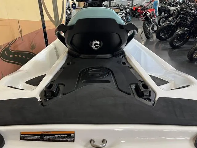Slide: The Image of 2025 Sea-Doo Waverunner GTI in showroom, rear view showcasing seat and deck design. - 11