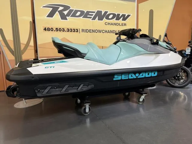 Slide: The Image of 2025 Sea-Doo GTI Waverunner displayed at RideNow Chandler showroom. - 4