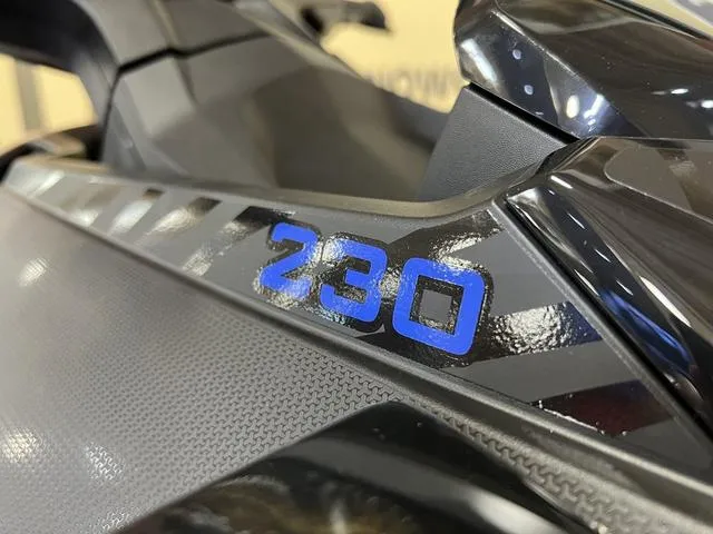 Slide: The Image of 2025 Sea-Doo Waverunner Wake, close-up of "230" decal on sleek black surface. - 10
