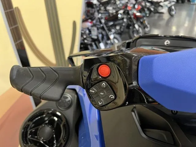 Slide: The Image of Close-up of 2025 Sea-Doo Waverunner Wake handlebar controls, featuring buttons and grip. - 7