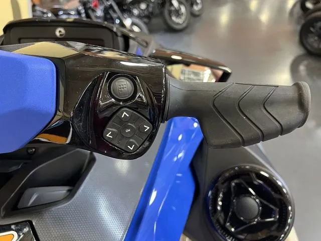 Slide: The Image of 2025 Sea-Doo Waverunner Wake handlebar controls, featuring ergonomic grip and navigation buttons. - 8