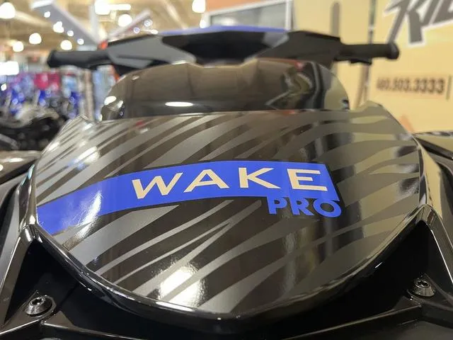 Slide: The Image of 2025 Sea-Doo Waverunner Wake Pro, sleek design with bold graphics, showcased indoors. - 9