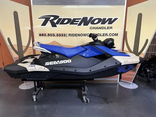 Slide: The Image of 2025 Sea-Doo Spark Trixx jet ski displayed at RideNow Chandler showroom. - 15