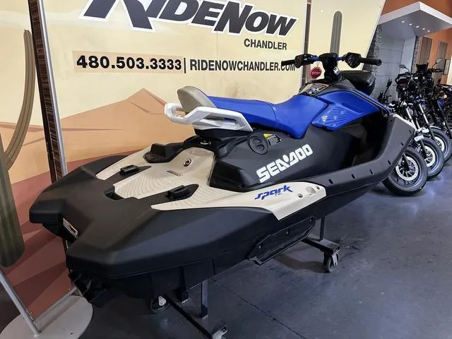 Slide: The Image of 2025 Sea-Doo Spark Trixx Waverunner displayed at RideNow Chandler showroom. - 4