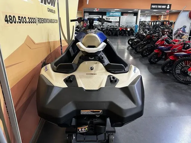 Slide: The Image of 2025 Sea-Doo Spark Trixx Waverunner displayed in showroom, rear view. - 5