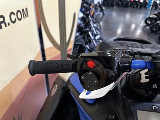 Slide: The Image of Handlebar controls of 2025 Sea-Doo Waverunner Spark Trixx, featuring buttons and grip. - 7