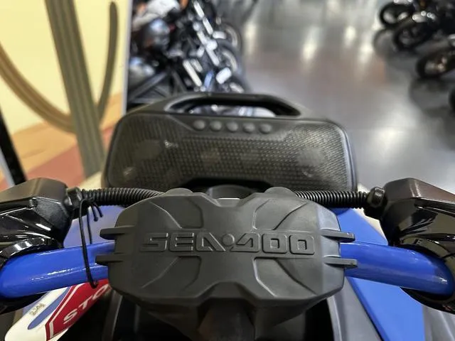 Slide: The Image of 2025 Sea-Doo Waverunner Spark Trixx handlebars and dashboard in showroom. - 8