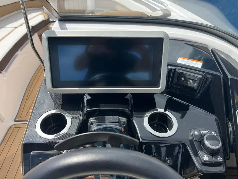 Slide: The Image of Dashboard of 2021 Yamaha Boats 252SE with touchscreen and controls. - 12