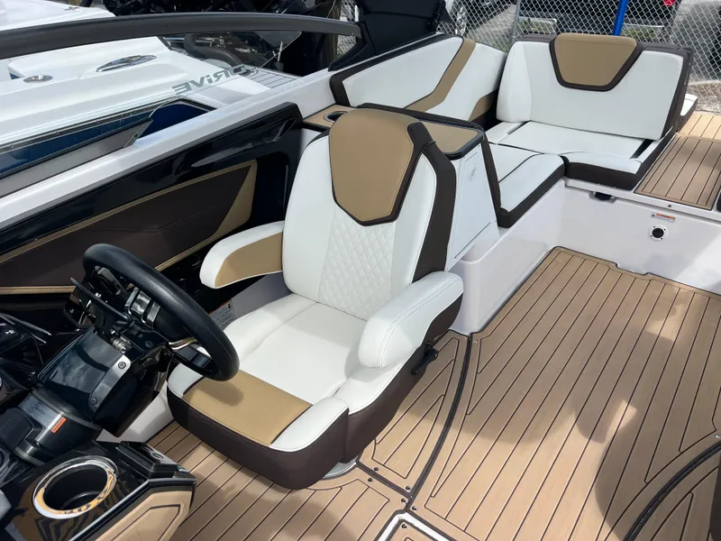 Slide: The Image of 2021 Yamaha Boats 252SE interior with luxurious seating and modern design. - 14