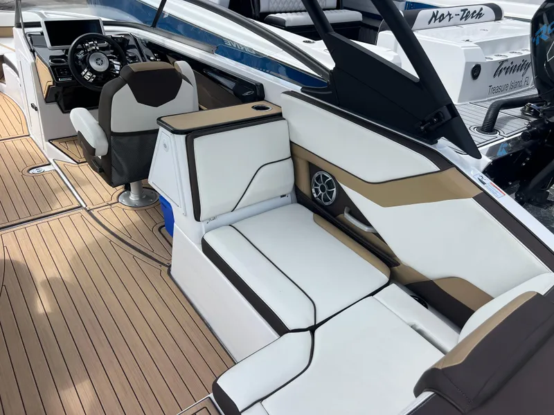 Slide: The Image of 2021 Yamaha Boats 252SE interior with sleek seating and modern dashboard design. - 17