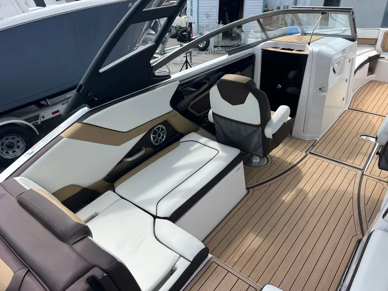 Slide: The Image of 2021 Yamaha Boats 252SE interior with sleek seating and modern design. - 18