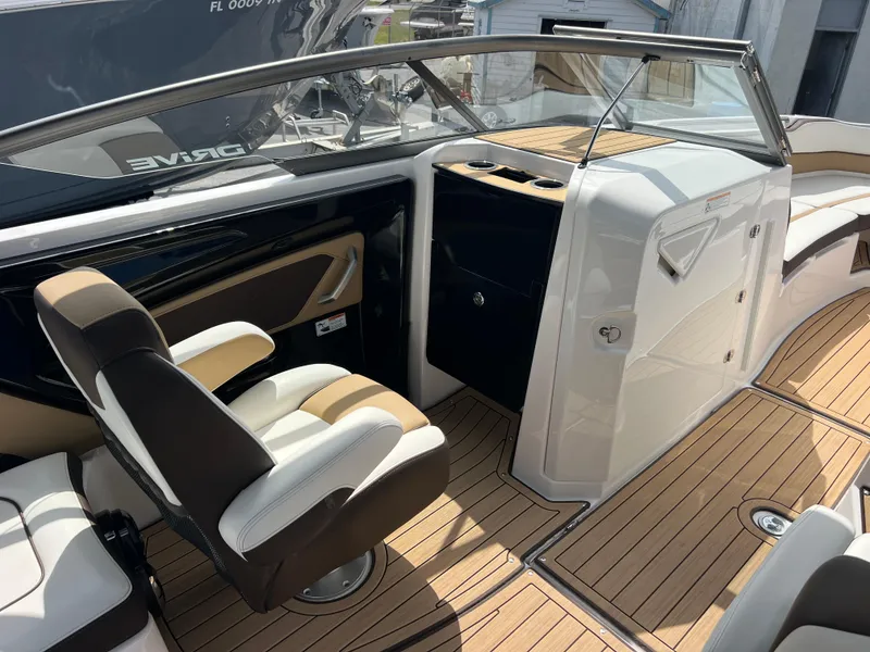 Slide: The Image of 2021 Yamaha Boats 252SE interior with sleek seating and modern dashboard design. - 20