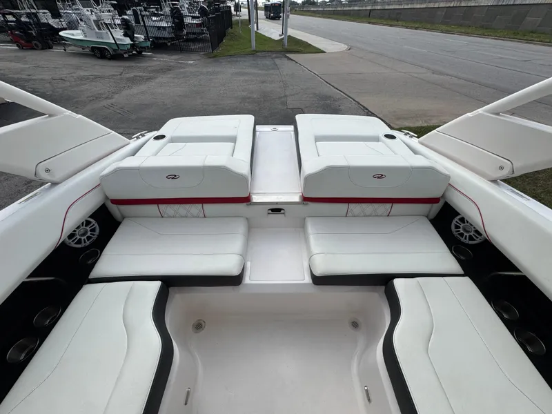 Slide: The Image of 2020 Regal LS2 Surf boat interior with white seating and modern design. - 11
