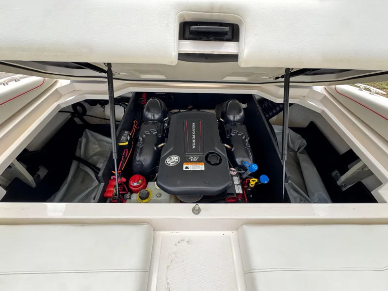 Slide: The Image of 2020 Regal LS2 Surf boat engine compartment with visible components and wiring. - 12