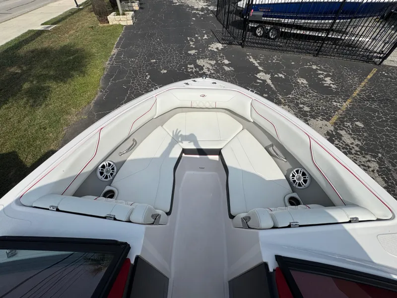 Slide: The Image of 2020 Regal LS2 Surf boat interior with white seating and speakers. - 18