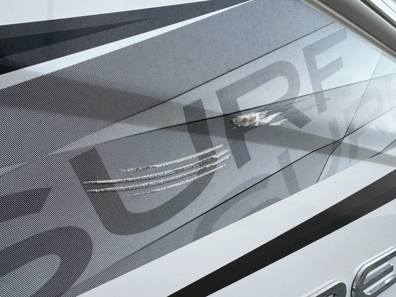 Slide: The Image of 2020 Regal LS2 Surf boat with stylish graphic design on the hull. - 6