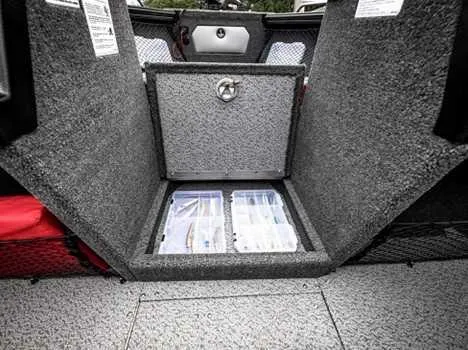 Slide: The Image of 2026 Lund 2075 Tyee boat storage compartment with organized tackle boxes. - 4