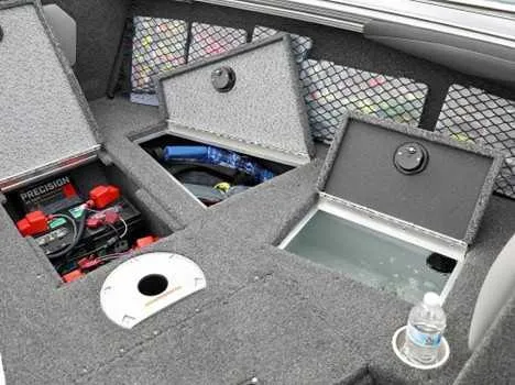 Slide: The Image of Interior of 2026 Lund 2075 Tyee boat with storage compartments and battery setup. - 8