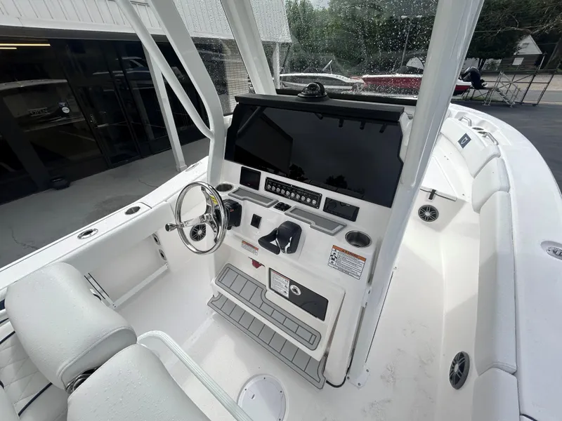 Slide: The Image of 2025 Sea Fox 248 Commander boat cockpit with modern steering and controls. - 10