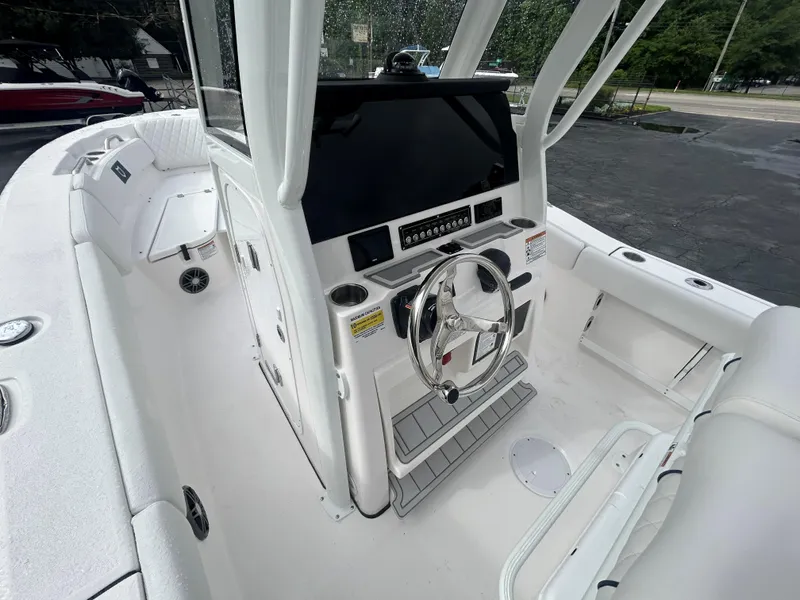 Slide: The Image of 2025 Sea Fox 248 Commander boat interior with modern helm and seating. - 11