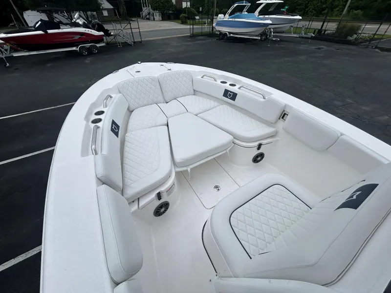 Slide: The Image of 2025 Sea Fox 248 Commander boat with spacious white seating area. - 13