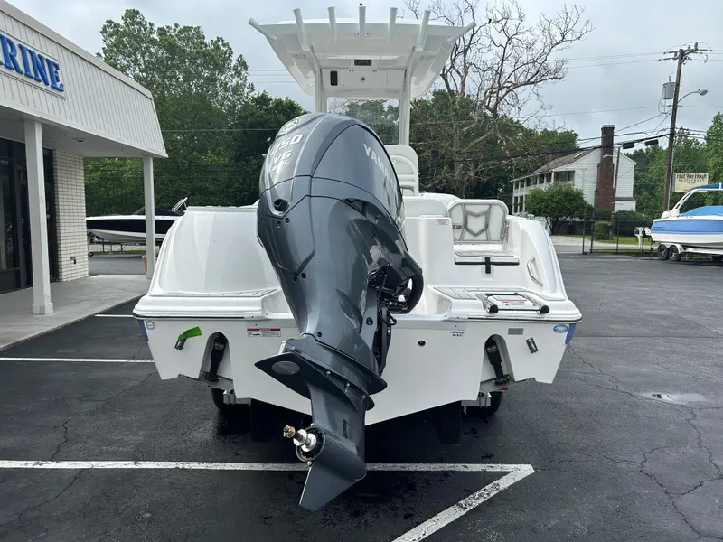 Slide: The Image of 2025 Sea Fox 248 Commander boat with Yamaha outboard motor, parked in a dealership lot. - 5