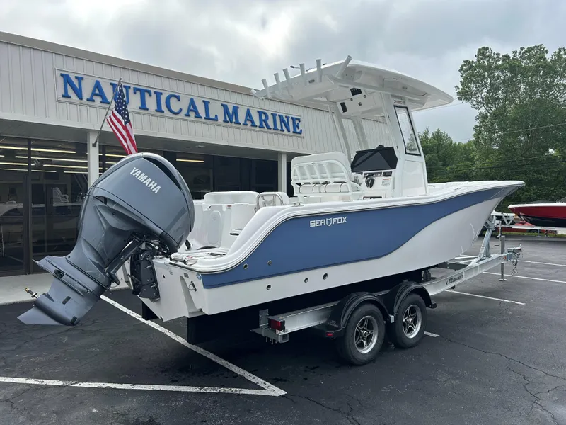 Slide: The Image of 2025 Sea Fox 248 Commander boat on trailer at Nautical Marine dealership. - 6