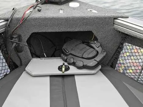 Slide: The Image of 2026 Lund 2075 Tyee boat storage compartment with gear and wiring. - 9