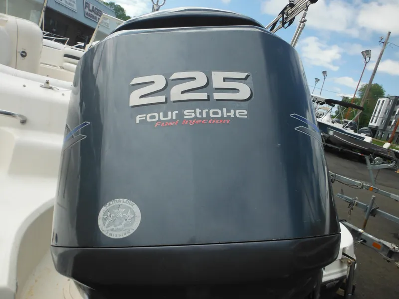 Slide: The Image of Outboard motor labeled "225 Four Stroke" on a 2007 Hurricane SD 237 boat. - 13