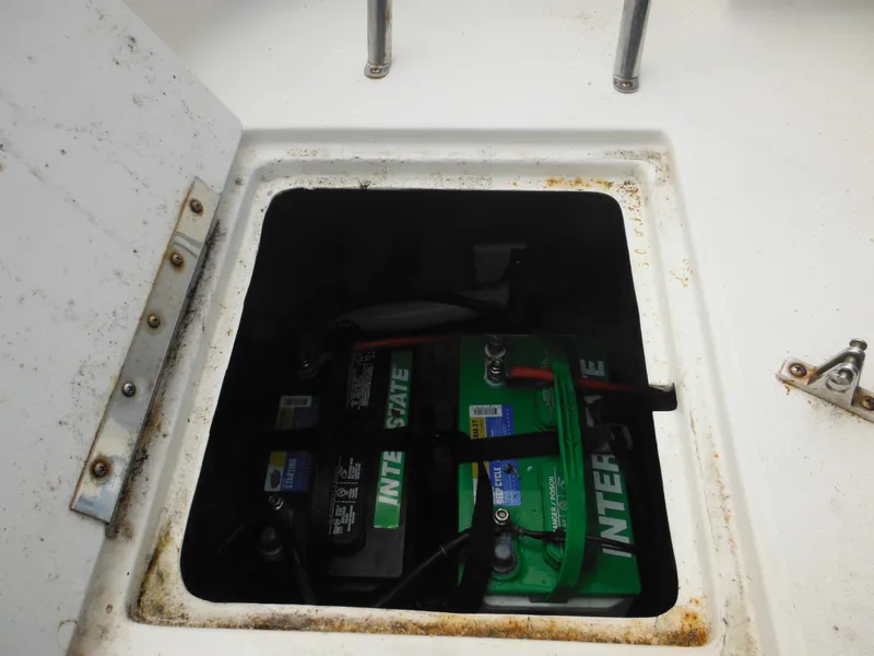 Slide: The Image of Battery compartment of a 2007 Hurricane SD 237 boat, featuring Interstate batteries. - 15