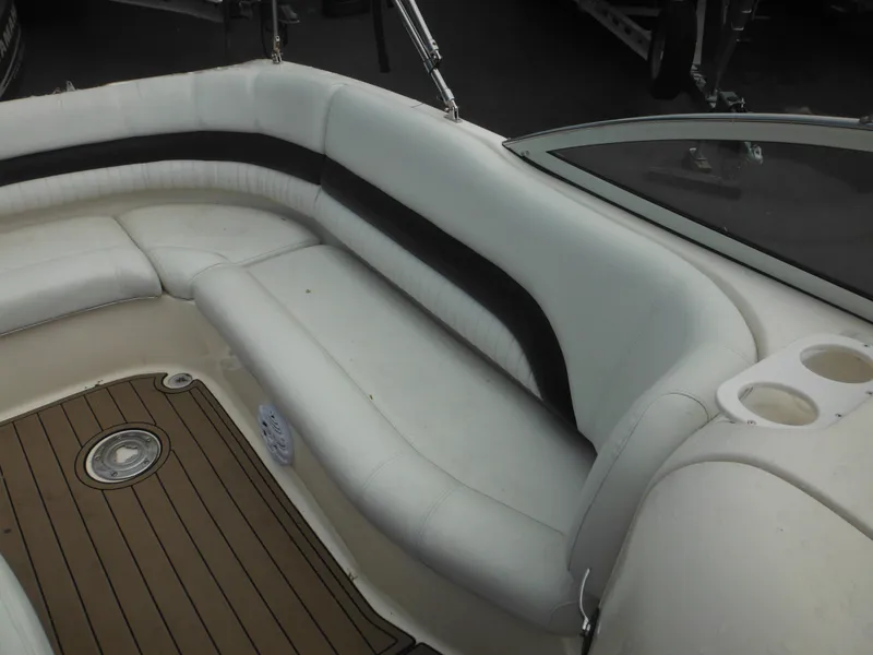 Slide: The Image of 2007 Hurricane SD 237 boat interior with white seating and wood-style flooring. - 19