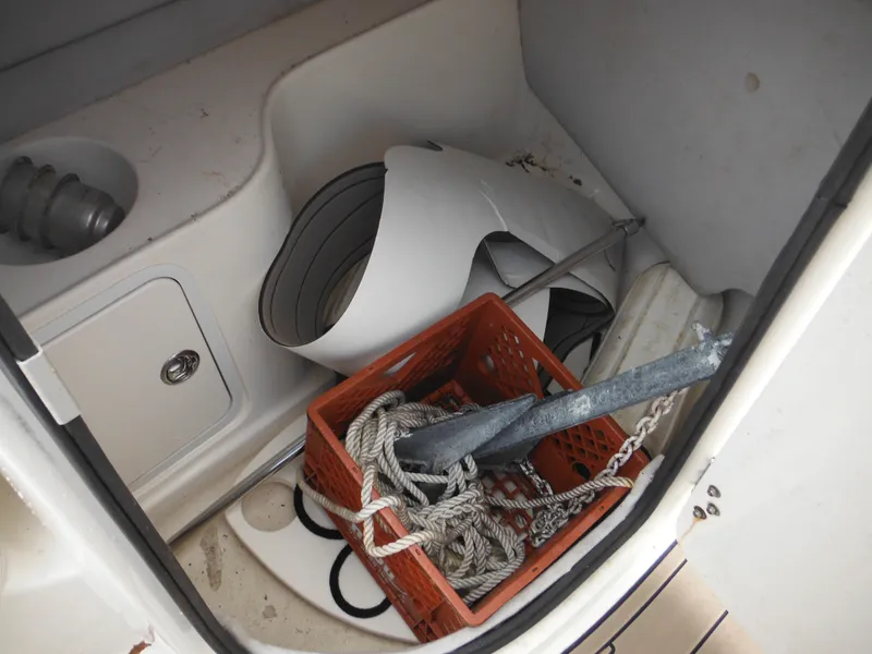 Slide: The Image of Storage compartment of 2007 Hurricane SD 237 boat with anchor and ropes. - 25
